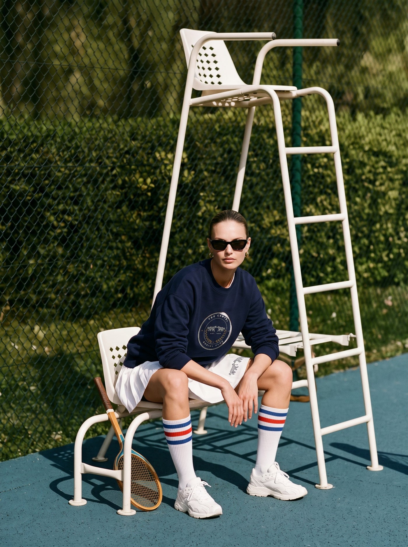 The Club Crew in navy, on the umpire chair